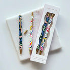 A set of two mechanical pencils with rainbow colors squiggle lines