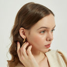 Rosey gold Croissant shaped Twisted Open Hoop Earrings - Ethically Made